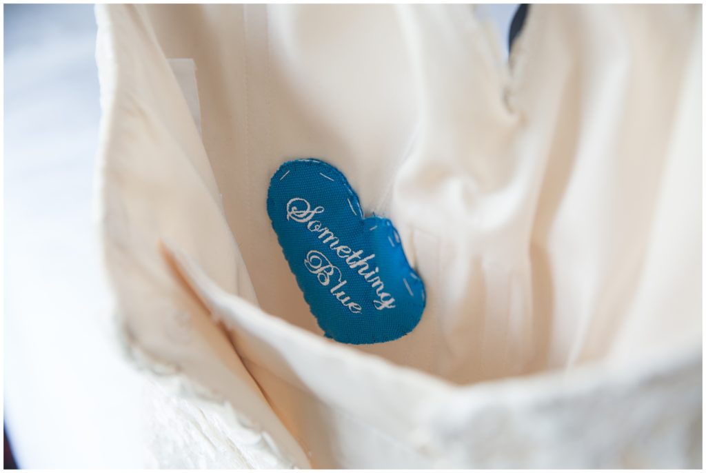 Blue Heart sewn in wedding dress is Erin’s Something blue wedding detail