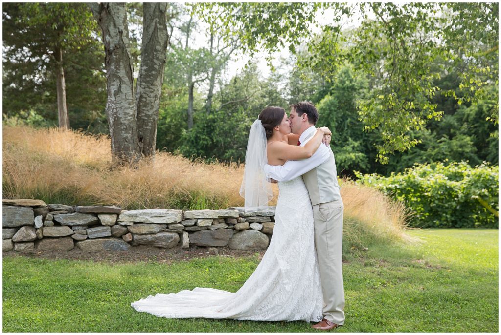 Bride and groom Kissing at Preston Ridge Vineyard in Connecticut.