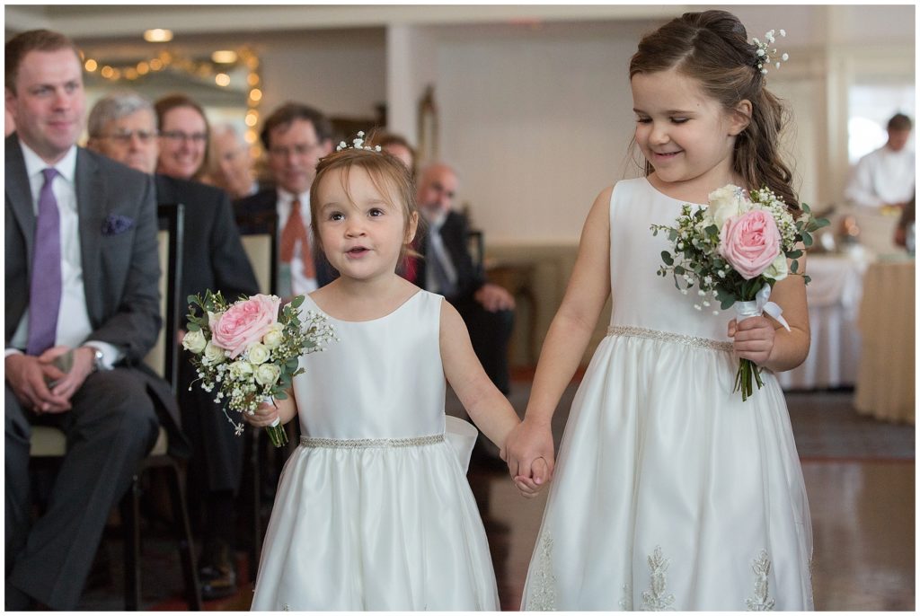 Flower girls carrying pink and white bouquet's.
